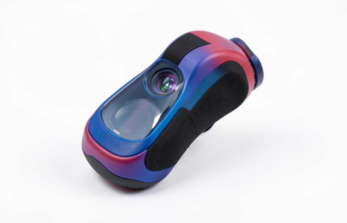 PolyJet prototype combining rigid coloured housing, clear lens and soft-touch rubber grip in one printed part